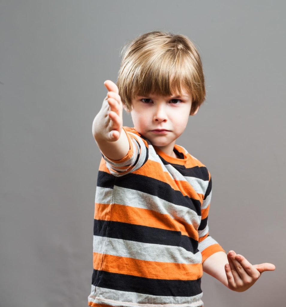 child making a ninja move for a summer camp game