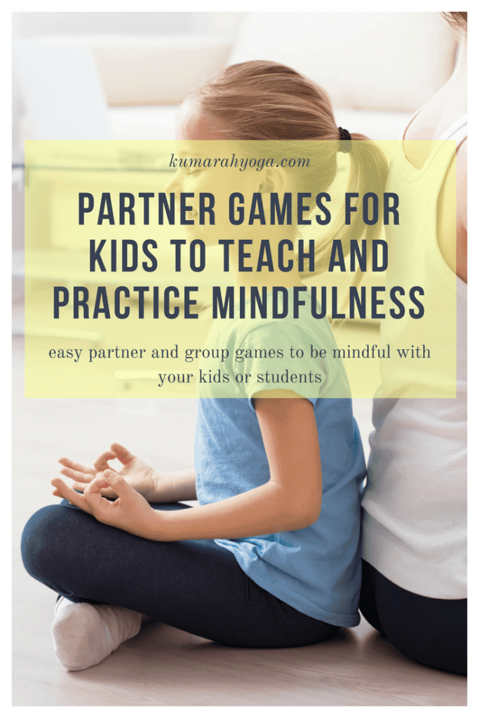 Kumarah yoga partner games for kids to teach and practice mindfulness, easy partner and group games to be mindful with your kids or students. a young girls sits and meditates back to back with an adult