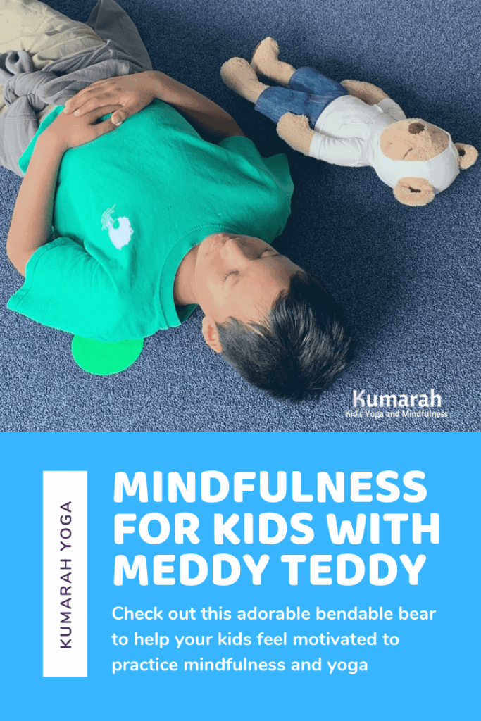 child and meddy teddy laying and meditating in savasana