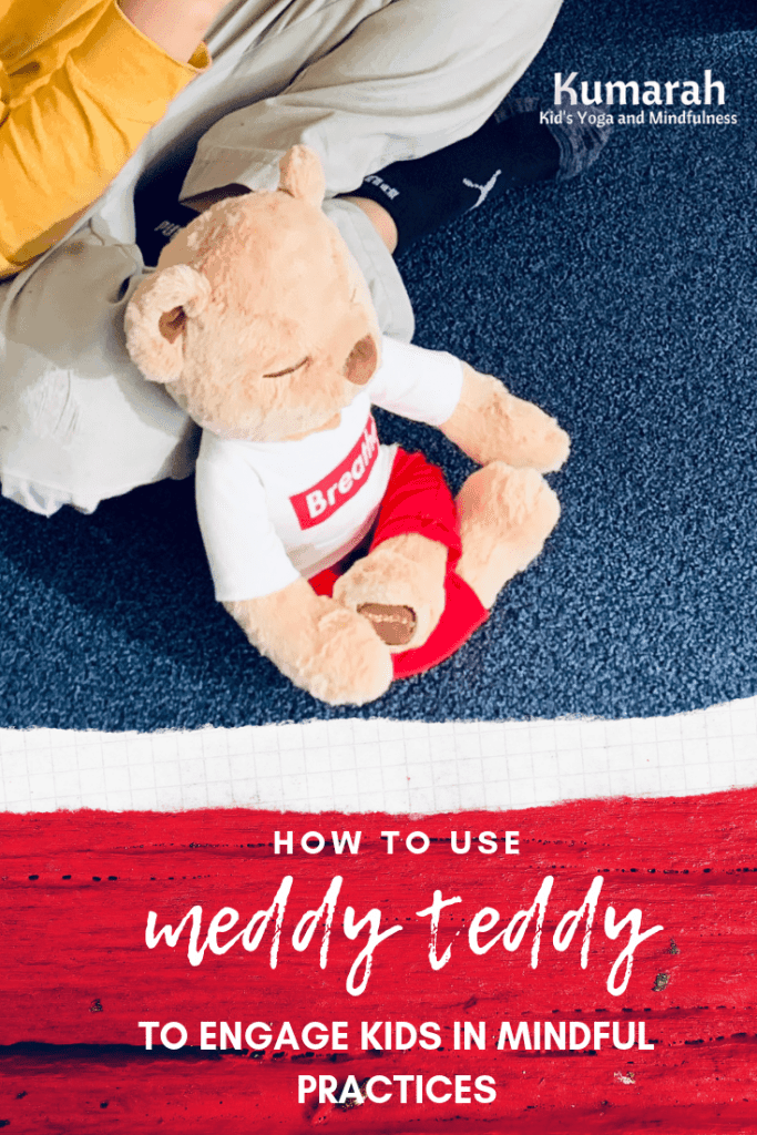 Meddy teddy sitting with a child practicing breathing and mindfulness