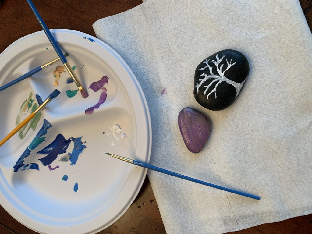 paint, paint brushes, smooth stones for mindfulness craft of kindness rocks