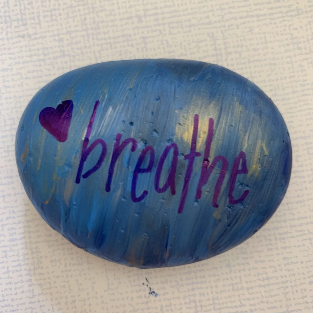 painted stone with the word 'breathe' - mindfulness craft of kindness rocks