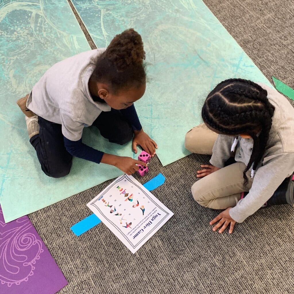 yoga games for kids, two kids playing the yoga dice game