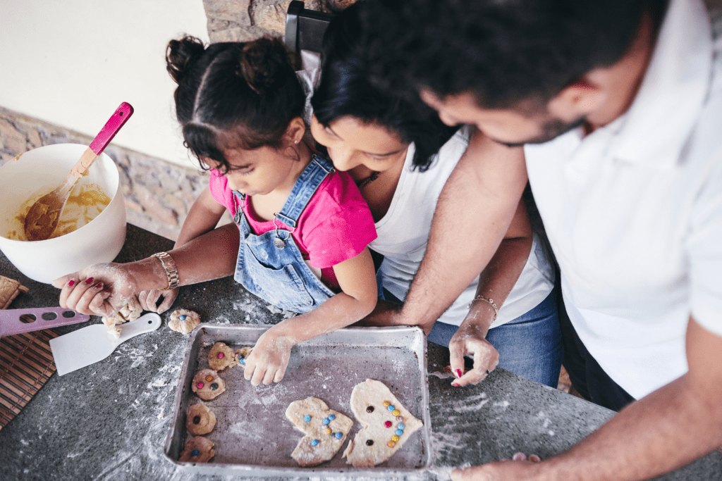 family baking in a messy kitchen and having fun