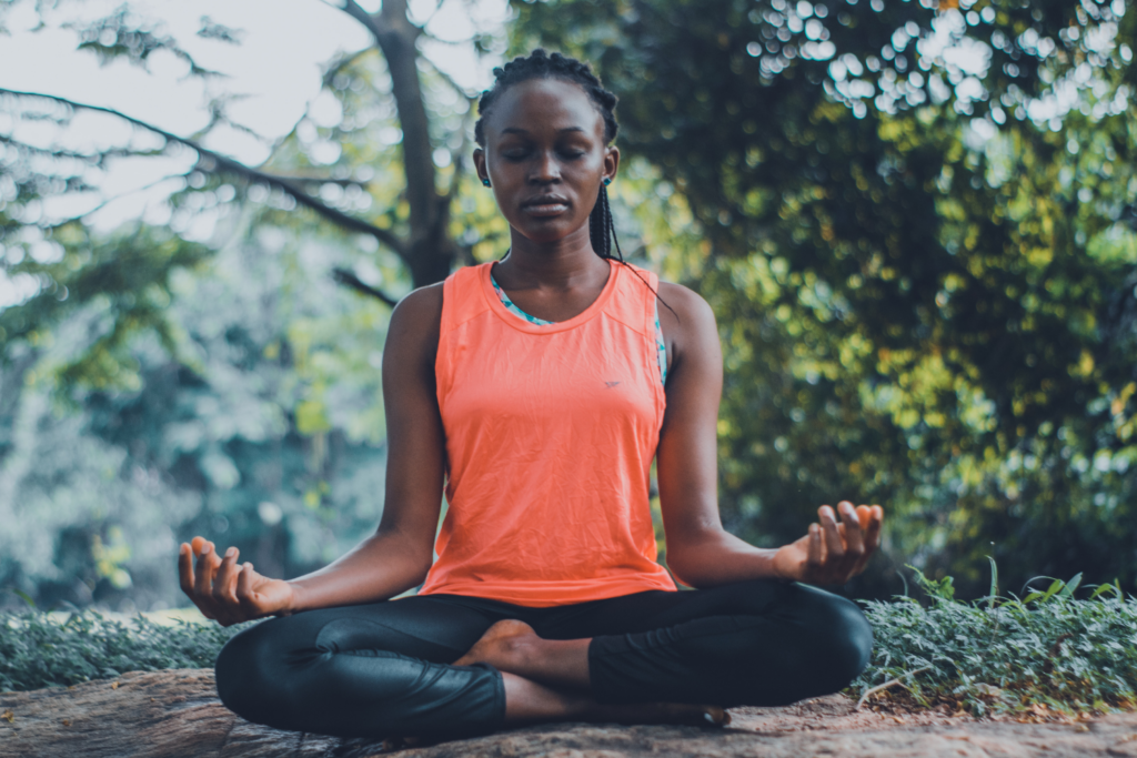 https://kumarahyoga.com/wp-content/uploads/2022/02/black-woman-doing-yoga-and-meditation-1024x683.png