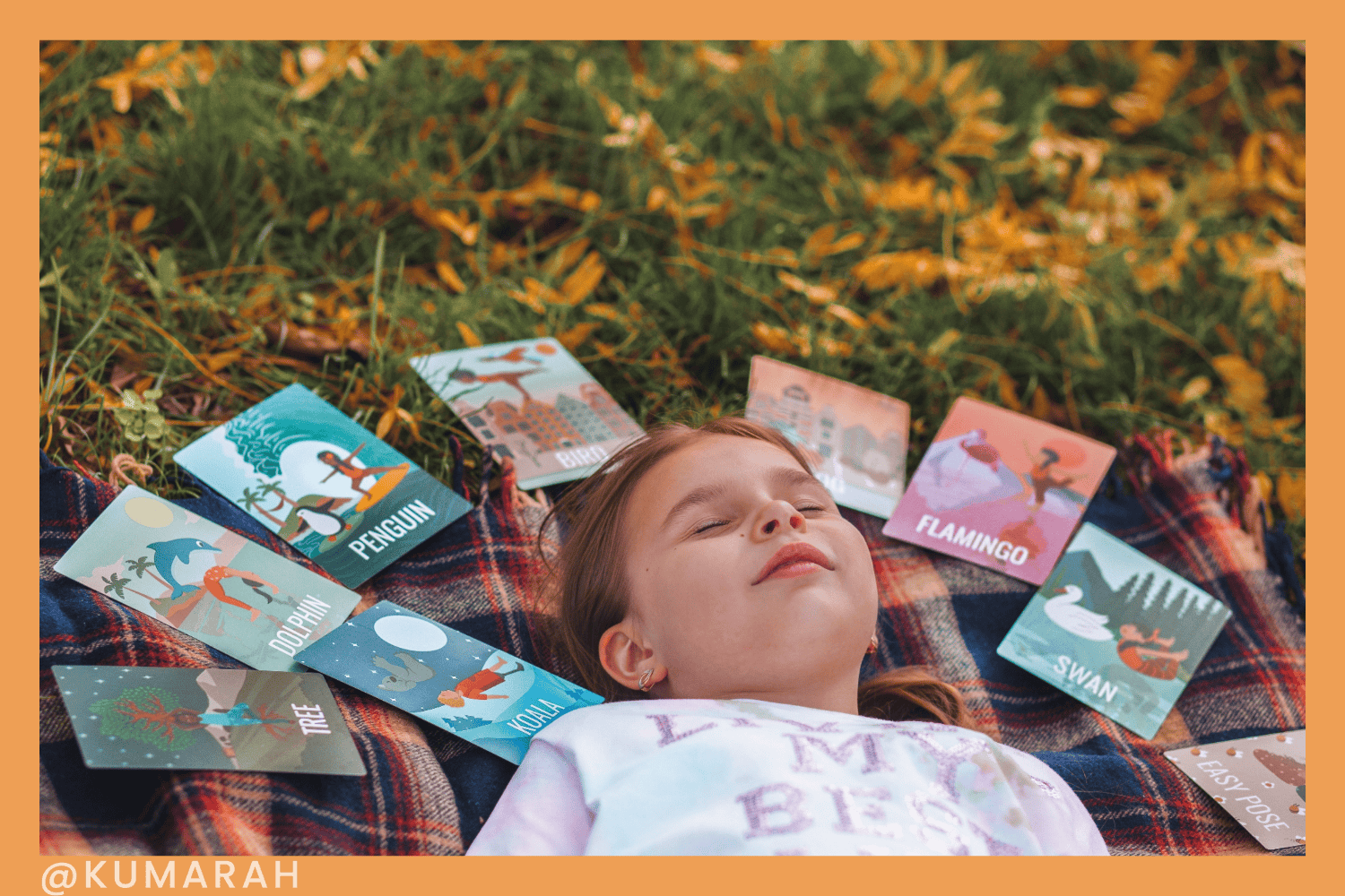 child with yoga pose cards lined up to create their own sequence