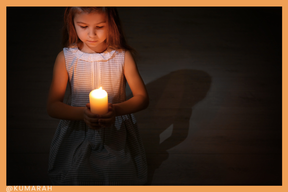 child feeling brave in the dark with a candle